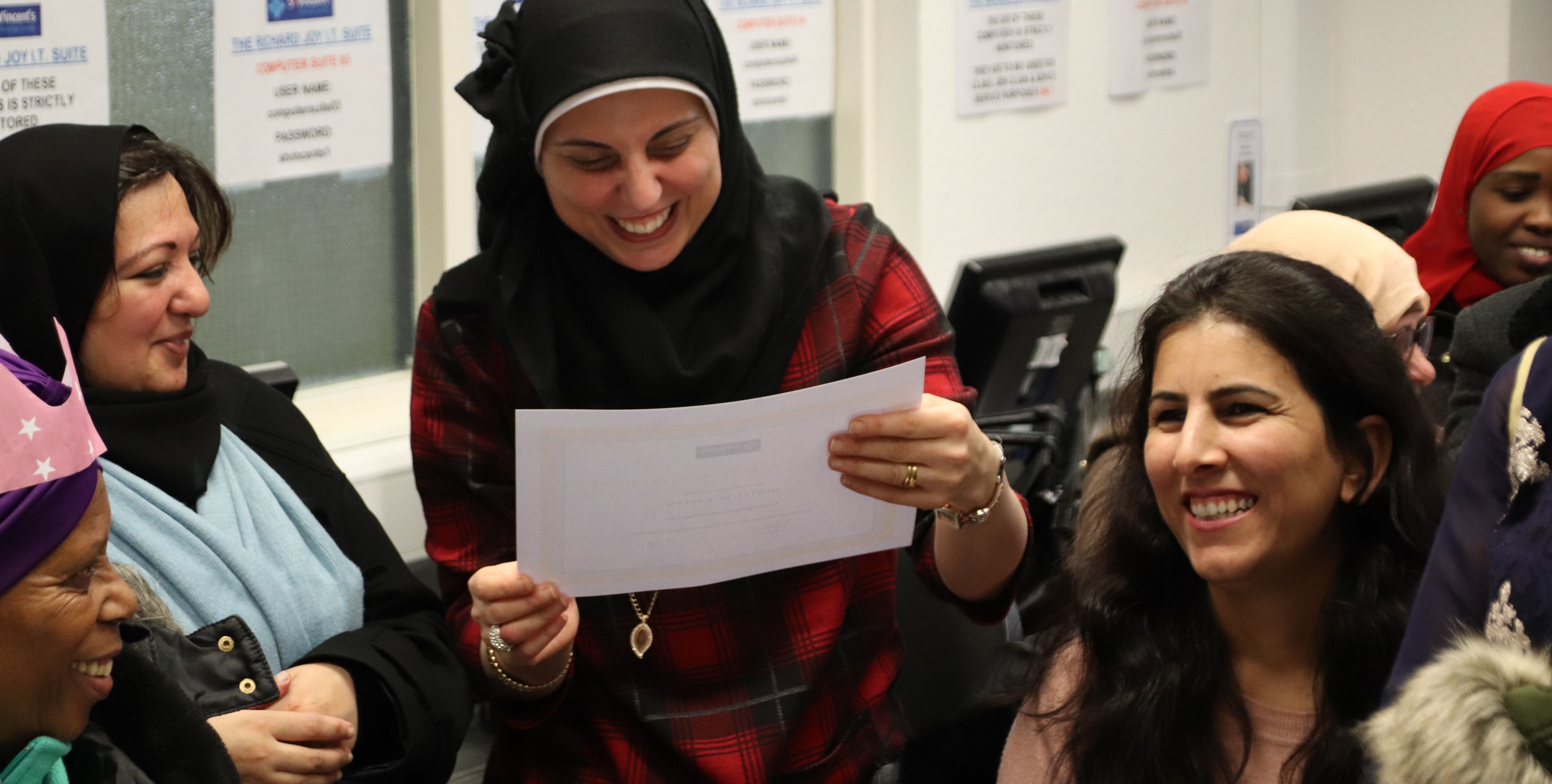 people of different races laughing in classroom