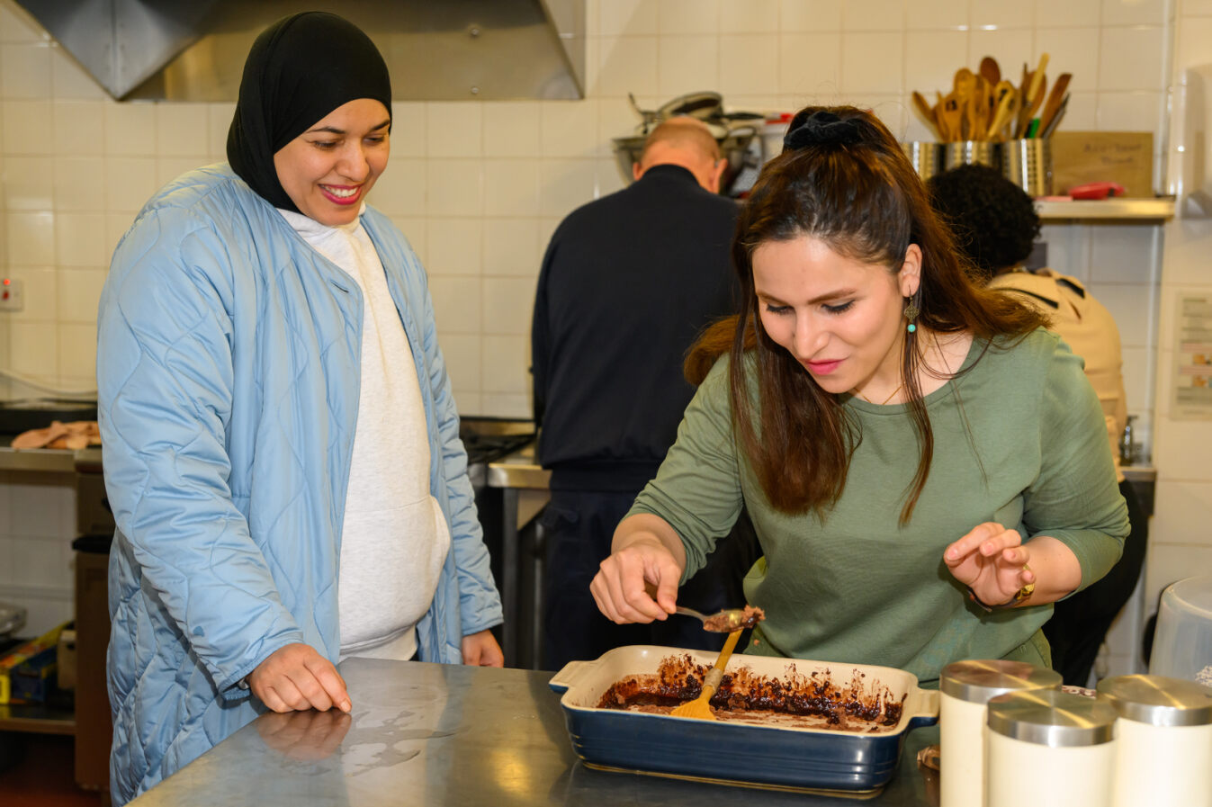 Image of two women cooking