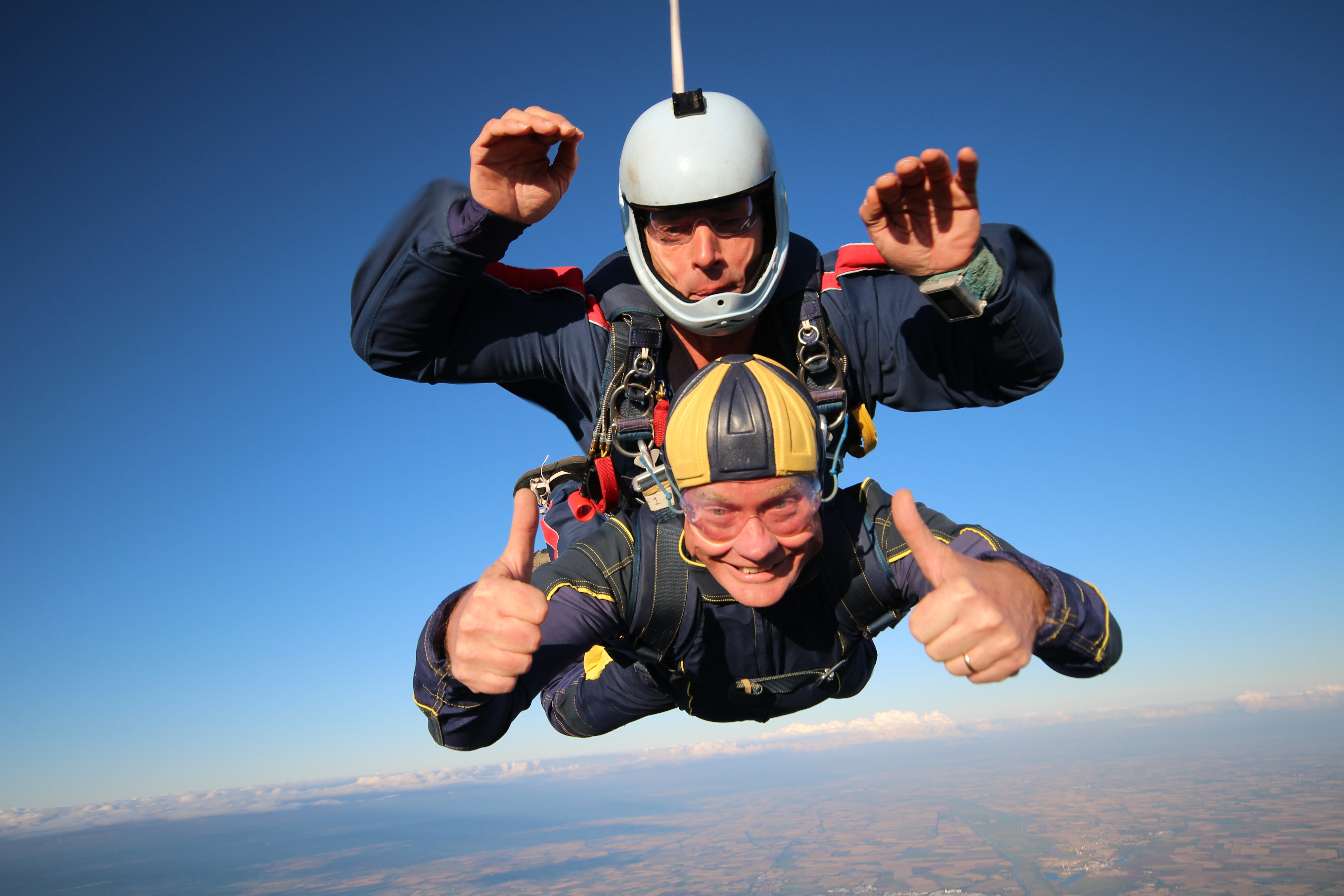 Two people sky diving