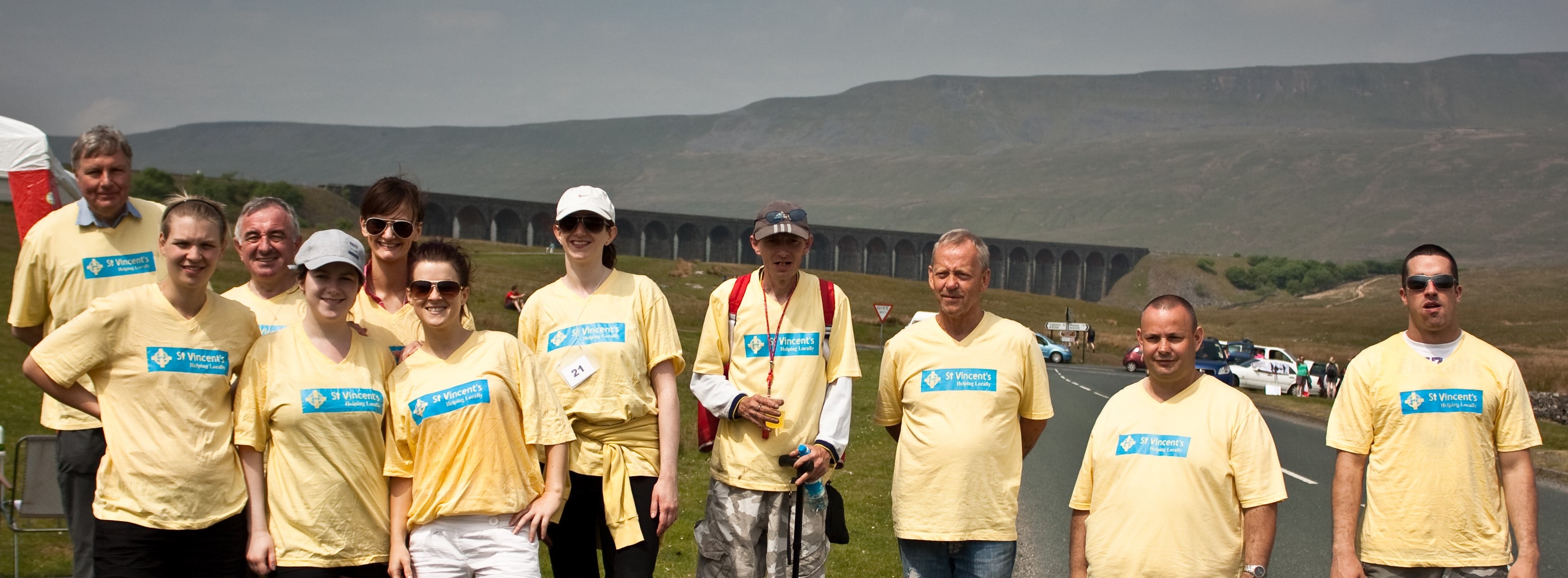 people in yellow tshirts at 3 peaks